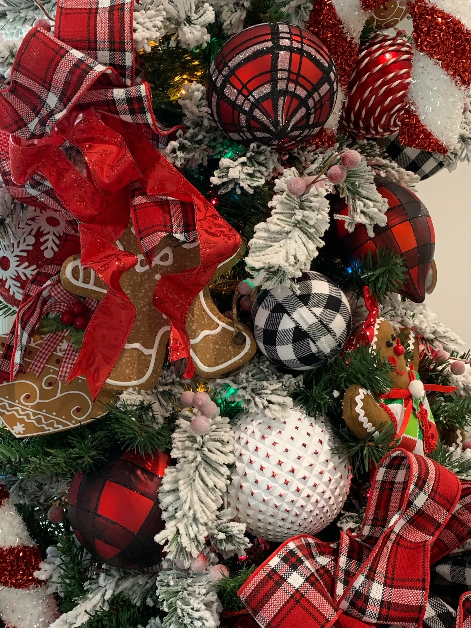 Close-up of real tartan ribbon and red Christmas ornament details