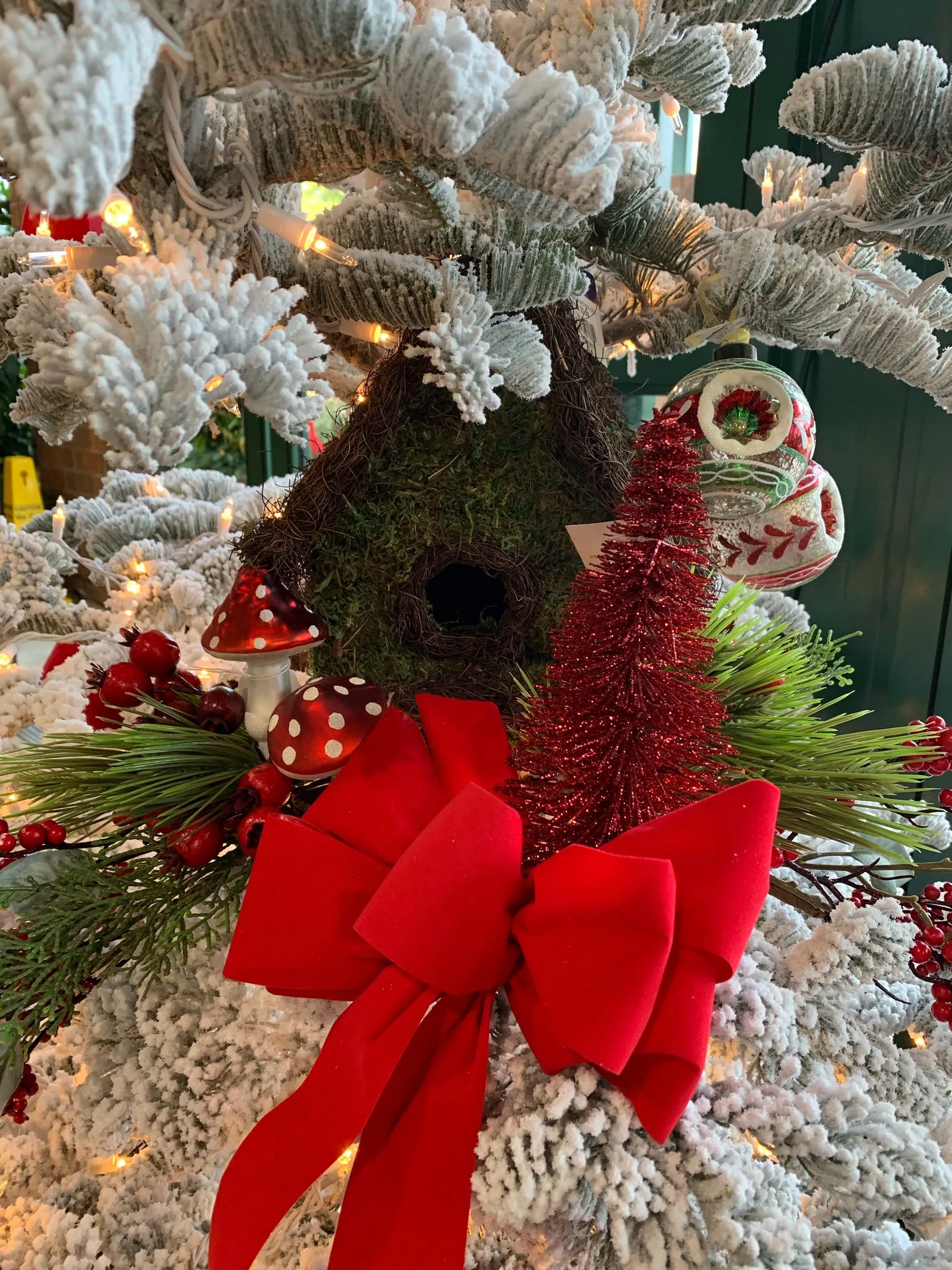 A real red Christmas floral and evergreen arrangement